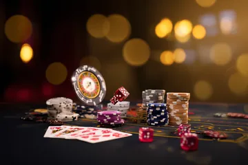 A close-up shot of golden coins falling around a spinning roulette wheel, representing immersive casino action at YAMANPLUS.