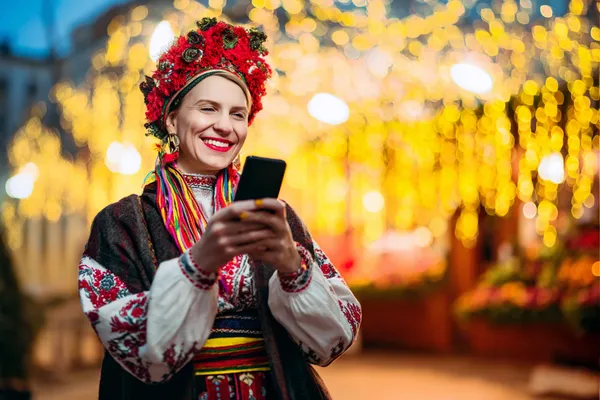 A woman in a luxurious green gown next to an ornate roulette wheel, capturing the upscale casino mood of YAMANPLUS.
