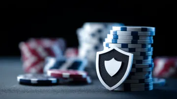 A laptop glowing with a bright login prompt in a minimalistic setup, symbolizing the protected access system at YAMANPLUS.